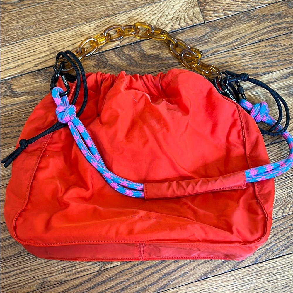 Rotunda Stylish Red Women's Bag with Chain Handle and pink/blue bungee strap
